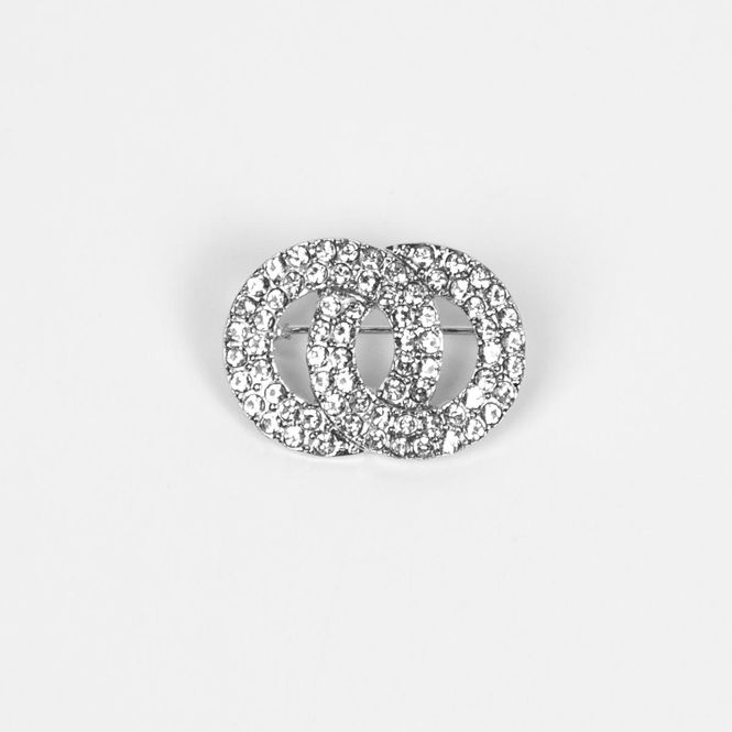 Hovedbilde Brosje i sølvfarget metall - dobbel ringform med ...